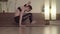 Flexible woman doing yoga exercises in studio