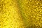 Flickering bright gold background. Bright gold or yellow texture.