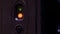 Flickering green and red light bulb. Alarm or data transmission system. Stage backstage equipment. Sensor technical device. Black