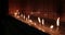 Flickering Prayer Candles in a Church - Side Angle View