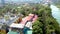 Flight above Buddhist monastary colorful roofs