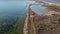 Flight from above on a quadcopter over the sea after sunset. Sea coast and salty, thermal lakes for treatment.