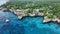 flight along stunning rocky cliffs landscape in West End, Negril, Jamaica,