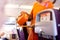 Flight attendant serving hot drinks to passengers on board.