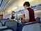 Flight attendants serving food to passengers during flight