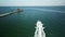 Flight behind a boat on the ocean