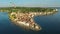 Flight with birds over old city Piran, aerial panoramic view with old houses, roofs, St. George`s Parish Church and fortress.