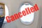 Flight cancelled. Coronavirus, red warning sign with text cancelled Flight in empty airplane cabin. Cancelled flight, no travel,