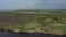 Flight of the copter over the river, fields and forests of Russia.