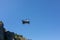 Flight of drone against blue sky on sunny day. quadcopter flying through sky. New aerial photo and video technology
