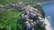 Flight by a drone of Corniglia village one of Cinque Terre coast of Italy in region of Liguria, Italy.Houses,plantation of grapes