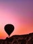 flight of fantasy, balloons in dramatic red and gold dawn