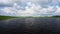 Flight just above the surface of the lake on the mountain plateau