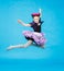 Flight of little girl in funny carnival costume