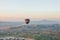 Flight of a lonely balloon in the sky in the morning at sunrise or in the evening at sunset. Travel by air or adventure