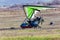 Flight on a motorized paraglider in mountainous terrain