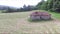 Flight next to Old abandoned cottage next to the forest in the meadow