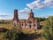 Flight over an abandoned church, ancient abandoned and ruined church, dilapidated red brick temple