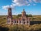 Flight over an abandoned church, ancient abandoned and ruined church, dilapidated red brick temple