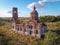 Flight over an abandoned church, ancient abandoned and ruined church, dilapidated red brick temple