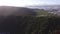 Flight over beautiful tropical beach Guaiuba. Waves crashing on rocks, sea green