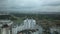 Flight over the city block in cloudy weather.