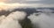 Flight over clouds, flying over the mountains, Morning fog.