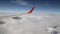 Flight over clouds. The plane flies above the clouds, view from the window