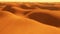 Flight over desert sand dunes