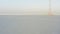 Flight over the frozen sea and drone view of Tokarevsky lighthouse at dawn