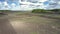 Flight over landscape with fields and forests under nice sky