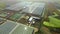 Flight over a large greenhouse complex. Industrial greenhouses for growing vegetables, fruits, flowers. Modern