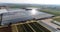 Flight over a large greenhouse. Growing vegetables in greenhouses. Large modern greenhouse. greenhouses aerial view