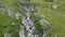 Flight over mountain brook with waterfalls in Texel group, South Tyrol, Italy