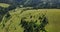 Flight over mountains covered with dense forests