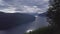 Flight over the Nordfjord Panorama viewpoint. To the side, the girl is standing with her back.