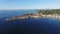 Flight over old city Piran in Slovenia, aerial panoramic view with St. George\'s Parish Church, fortress and the sea.