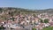 Flight over of the old town on Sololaki hill, crowned with Narikala fortress, the Kura river and old buildings and city