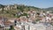 Flight over of the old town on Sololaki hill, crowned with Narikala fortress, the Kura river and old buildings and city