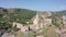 Flight over of the old town on Sololaki hill, crowned with Narikala fortress, the Kura river and old buildings and city infrastru