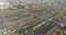 Flight over the railway depot. Freight trains at the depot. Large industrial railway depot top view.