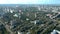 Flight over residential area. Summer day, houses, roads and trees. Top view.