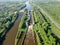 Flight over the river. Passage of hydraulic locks on the channel by commercial cargo ship