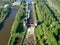 Flight over the river. Passage of hydraulic locks on the channel by commercial cargo ship