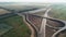 Flight over a traffic intersection. Transport interchange of highways. Road under construction. Beautiful view. A