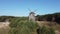 Flight over windmill on a hill