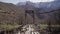 Flight over the wooden pedestrian bridge in the mountains