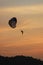 Flight on a parachute at sunset
