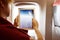 Flight Passenger taking Photo throw Plane Window on Tablet PC