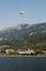 Flight on a special parachute above the water on the background of the Adriatic coast.